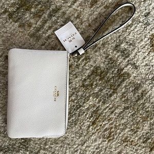 NWT - white leather with gold accents Coach wristlet - two inside card pockets